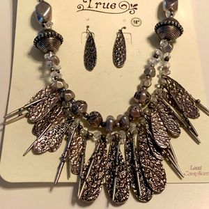 Hammered silver necklace with matching earrings.